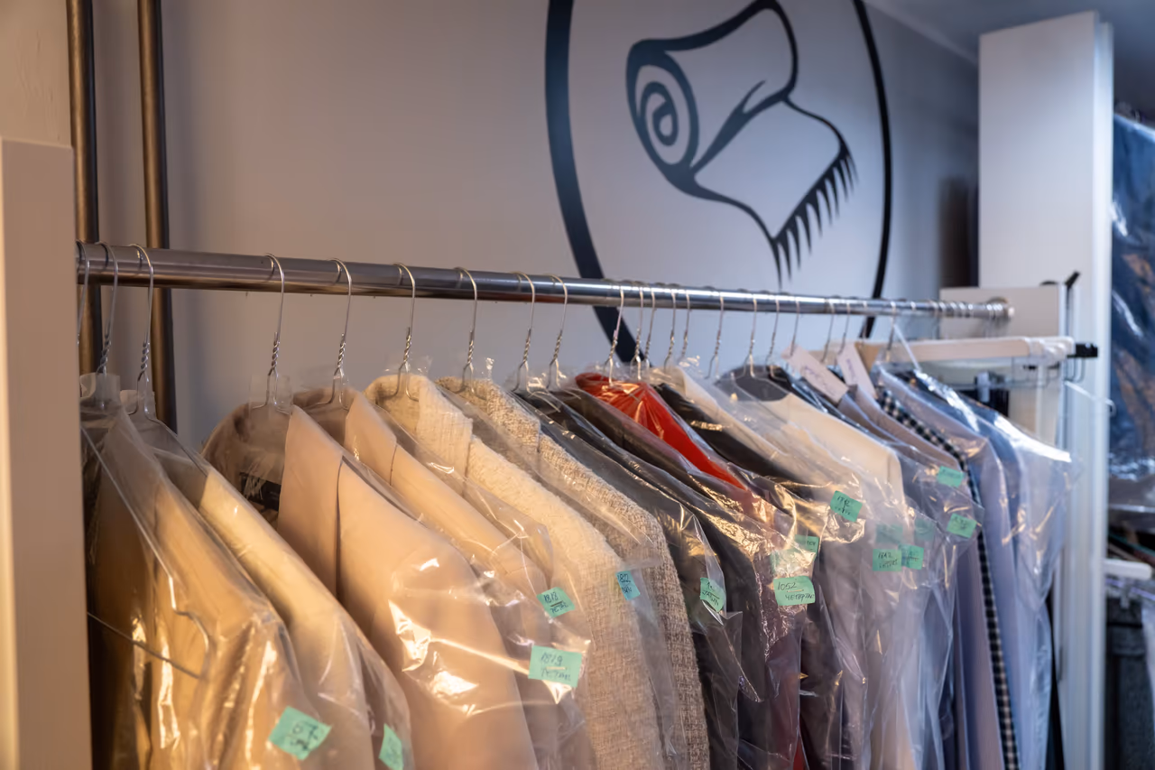 Racks of cleaned garments protected in covers
